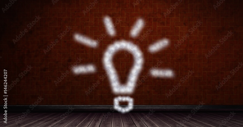 Obraz premium Digital composite image of light bulb shape on brick wall