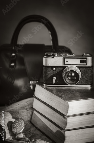 Bild auf Leinwand Camera, books, clock and road map