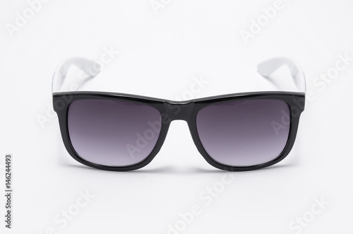 Mens sunglasses in thick black plastic frame isolated on white