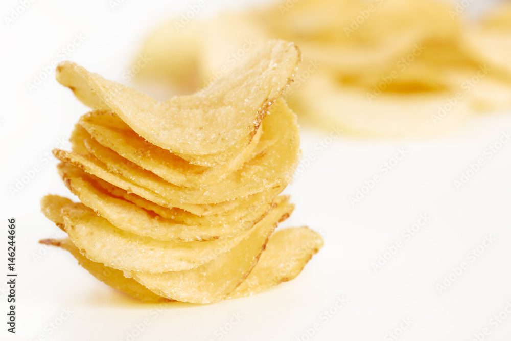 Crispy potato chips isolated on white background close-up Crispy potato chips isolated on white background close-up