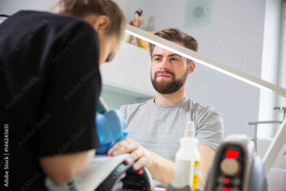 Man during manicure Man during manicure