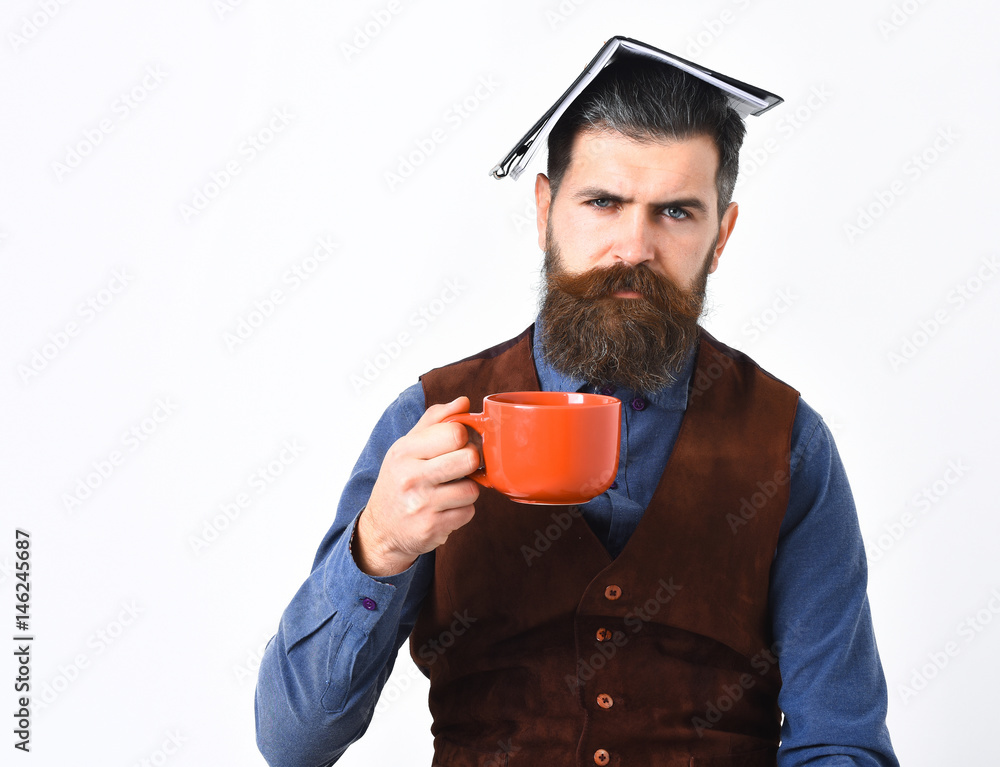 bearded man holding notepad, cup of tea with serious face bearded man holding notepad, cup of tea with serious face