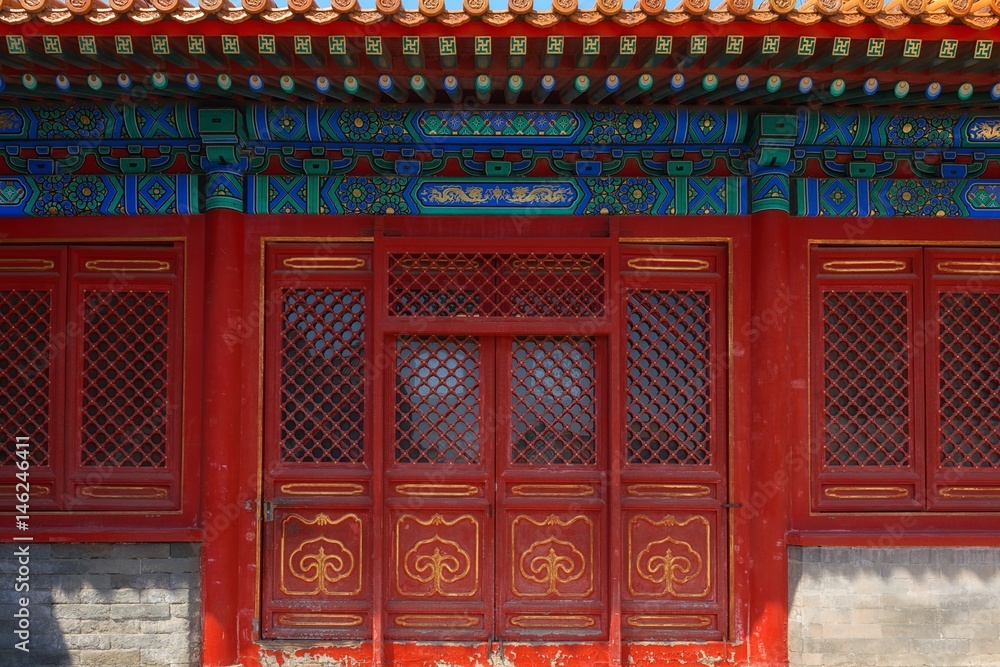 Gateway with red Chinese doors