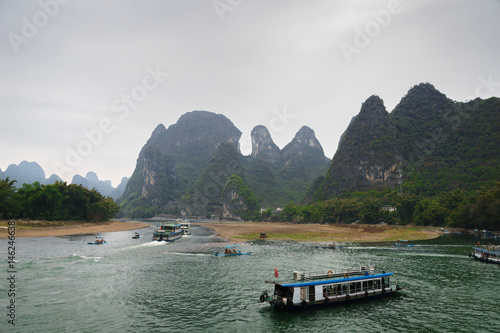  Li river and karst mountains / hills in Yangshuo, Guangxi, China, one of China's most popular tourist destinations. photo