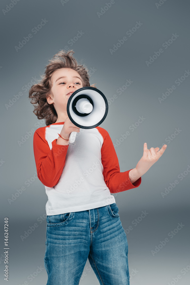 Fototapeta premium Boy using loudspeaker