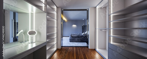 Interior of wardrobe with empty shelves photo