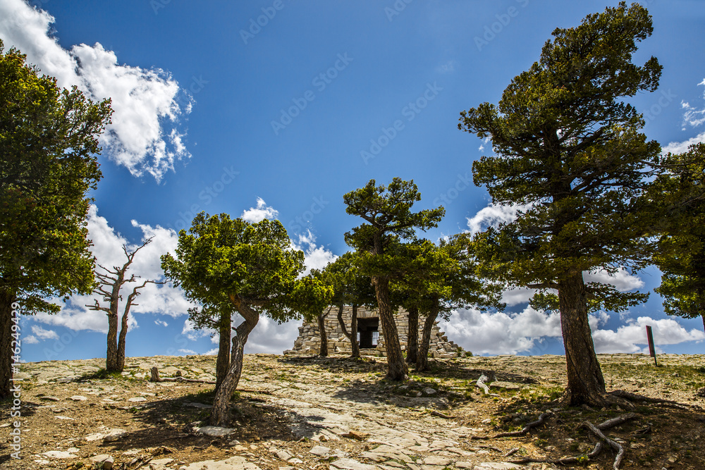 Fototapeta premium old rock house up on a mountain top