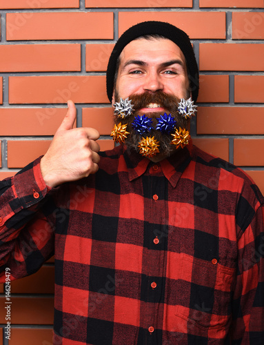 Fényképezés Bearded man, brutal caucasian amused hipster with gift decorative stars