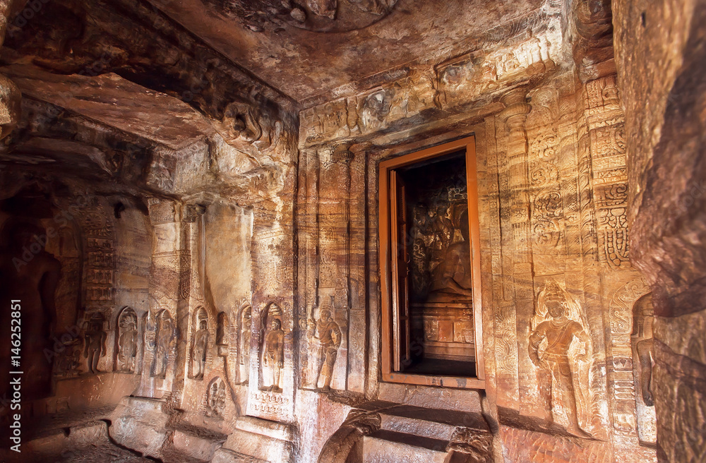 Interior of the 7th century cave temple in Badami complex of Karnataka, India. Inside are four Hindu, Jain and Buddhist cave temples
