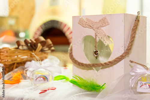 Rainbow wedding or event production. Heart lantern with coloured plumage and handmade ball favor  PACE e AMORE (translation PEACE and LOVE) photo