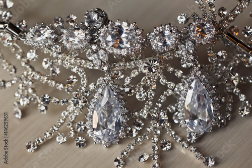 Beautiful silver necklace and earrings on the table © nastasenko