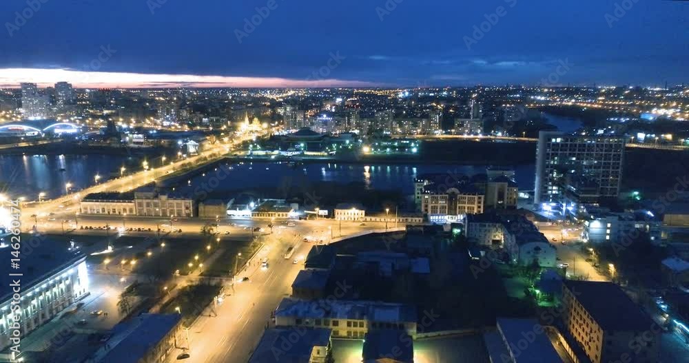 Aerial night illuminated cityscape view of rolling city streets and districts. Chelyabinsk, Russia. Aerial night illuminated cityscape view of rolling city streets and districts. Chelyabinsk, Russia.