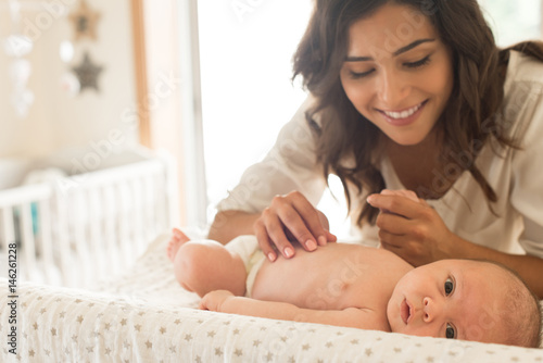 Mother moisturizing baby