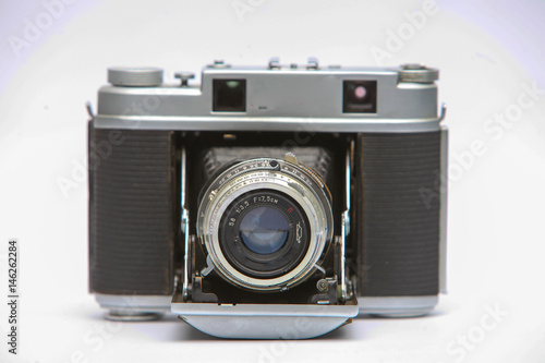 Vintage film camera. Isolated on white background