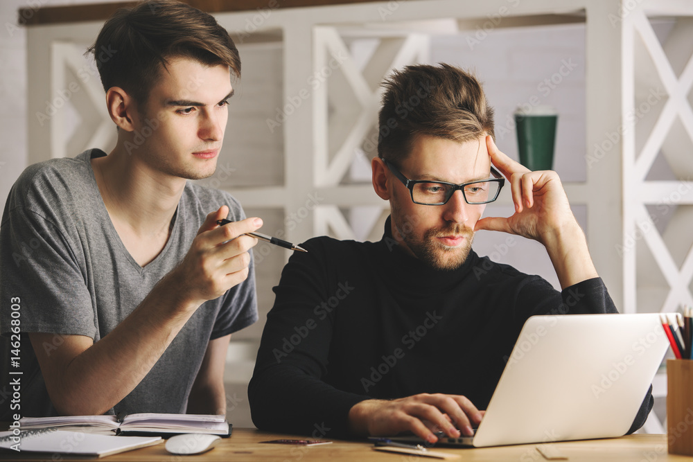 Attractive men discussing project Attractive men discussing project