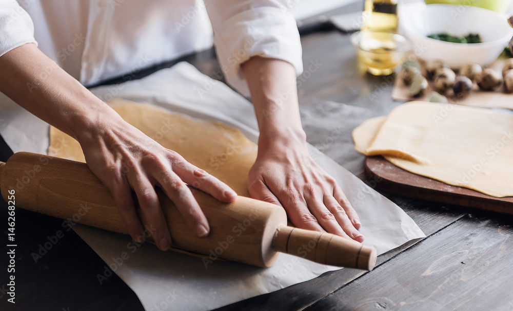 Step by step the chef prepares ravioli with ricotta cheese, yolks quail eggs and spinach with spices. The chef works with the dough Step by step the chef prepares ravioli with ricotta cheese, yolks quail eggs and spinach with spices. The chef works with the dough