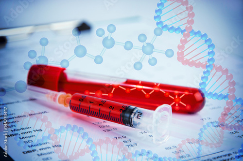 DNA testing of the blood in the laboratory with blood sample collection tubes and syringe. (blue tone)