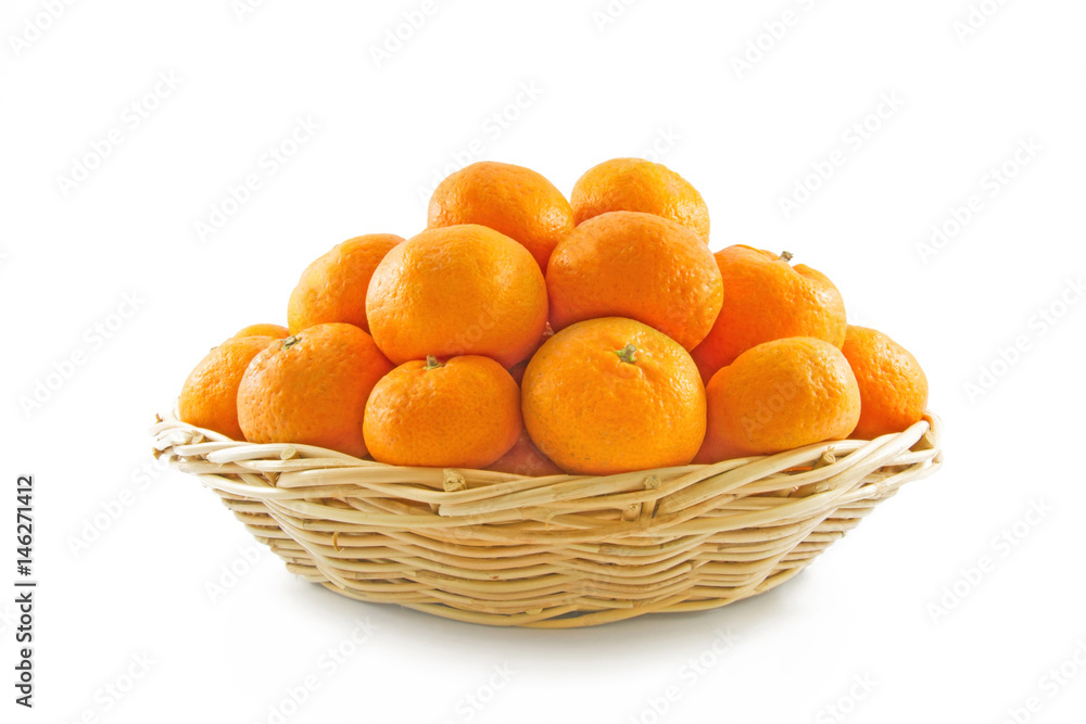 Many ripe oranges crop in brown wicker basket isolate on white background. Many ripe oranges crop in brown wicker basket isolate on white background.