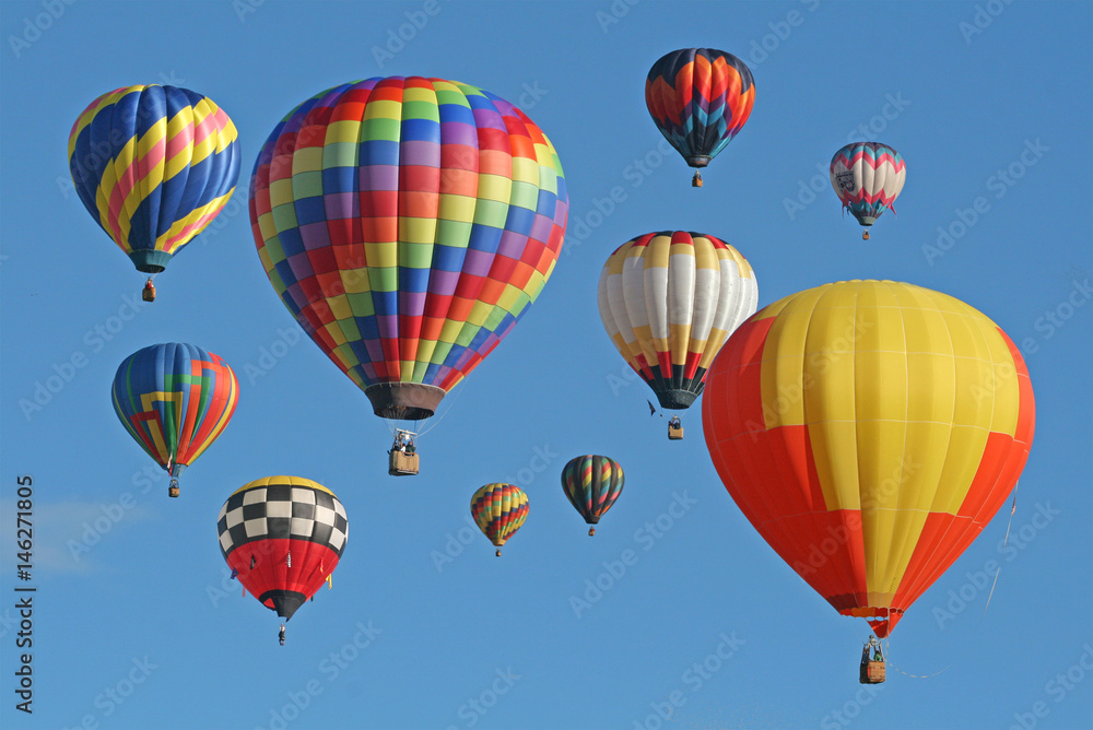 Collection of hot air balloons against a blue sky Collection of hot air balloons against a blue sky