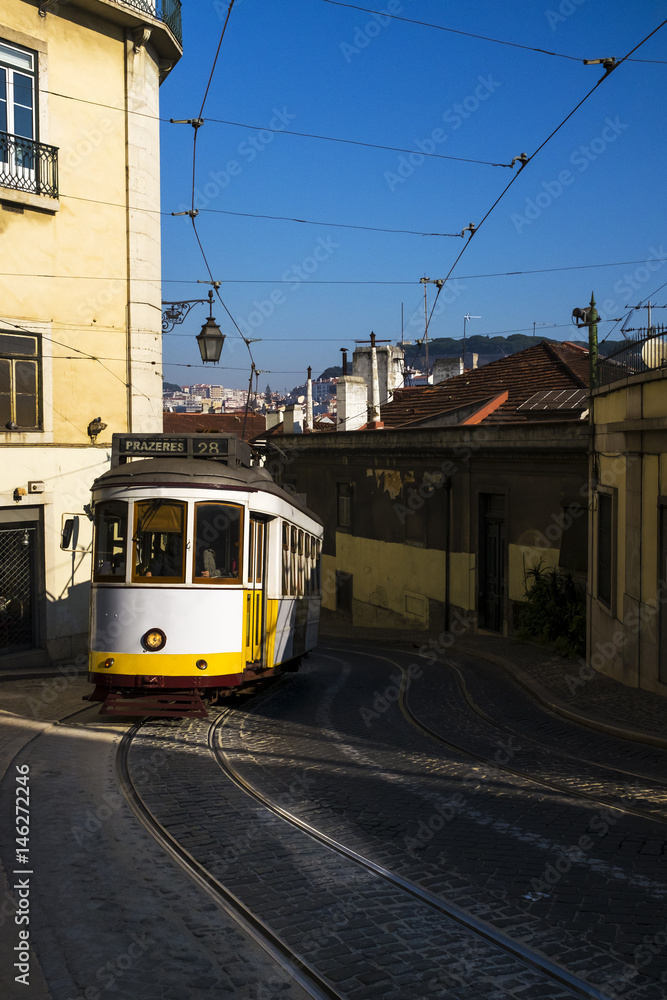 The traditional 28 Tram in the historic neighborhood of Chiado in Lisbon, Portugal; Concept for travel in Lisbon