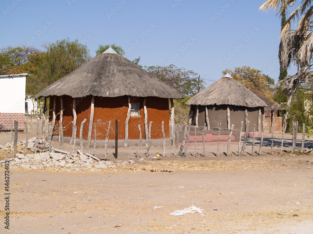 Small African village road, homes and people of Gweta Botswana Small African village road, homes and people of Gweta Botswana