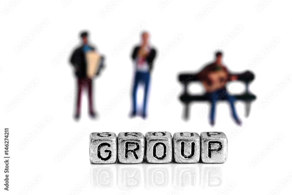 Miniature scale model musicians standing behind the word group on beads Miniature scale model musicians standing behind the word group on beads