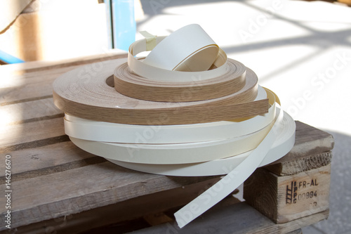 Multicolored bobbins of PVC edge and melanin for the manufacture of furniture. Lie pyramid.