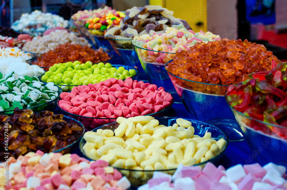many varieties of jelly candies on a market stall