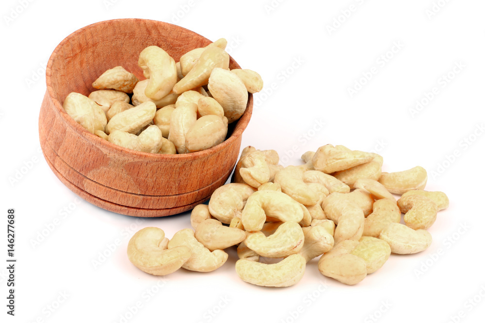 cashew in wood plate isolated on white background cashew in wood plate isolated on white background