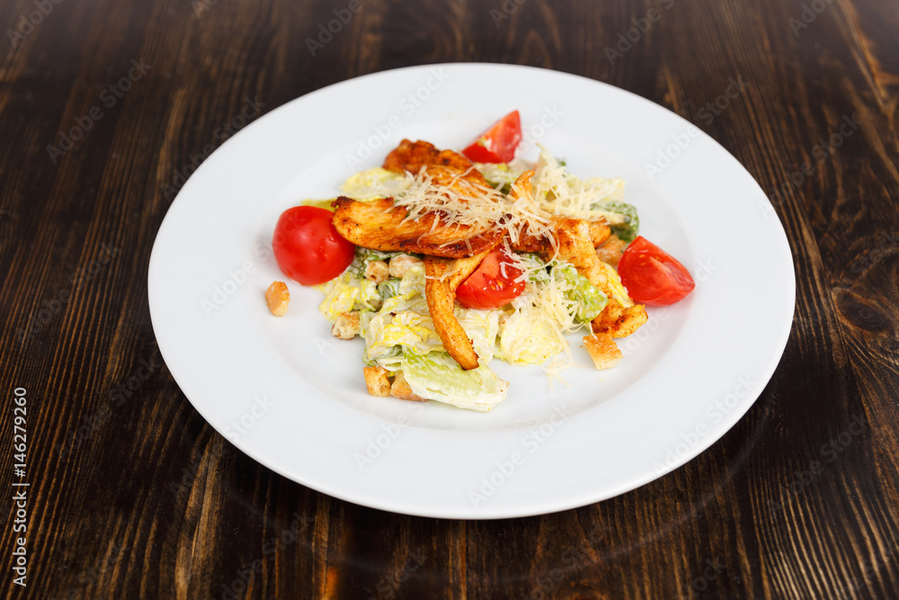 Plate with fresh caesar salad with chicken Plate with fresh caesar salad with chicken