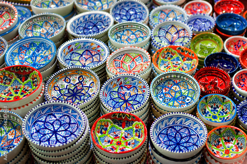 Many traditional asian handpainted porcelain bowls on a market stall