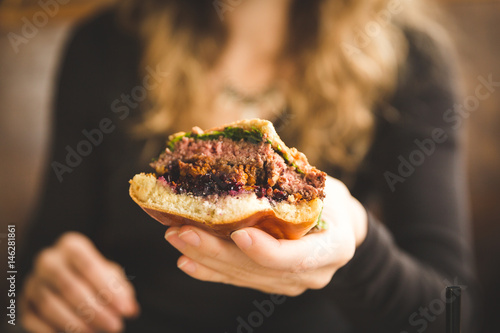 Woman Holding Hamburger