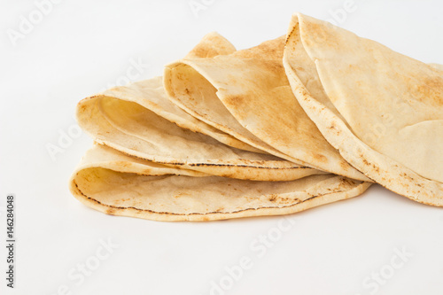 Tortilla  cakes made of wheat flour on a white background