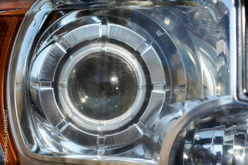 Headlight car Projector LED of a modern luxury technology and auto detail.