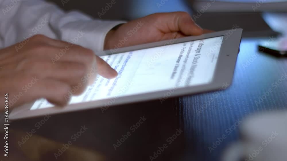 Businessman Using A Tablet sitting at the table at the corporate office, 4K - 5 Businessman Using A Tablet sitting at the table at the corporate office, 4K - 5