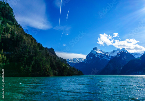 Mountains at lake Lucern and Village Brunnen. View from boot, Switzerland