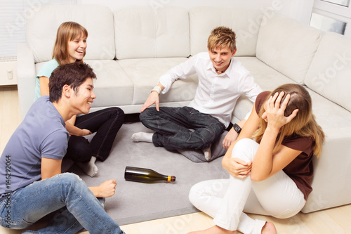 Friends Playing Spin The Bottle photo