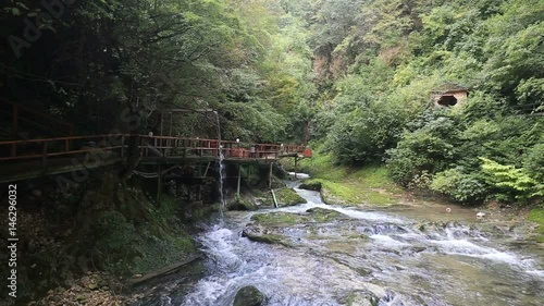 View on mountain river and bridge photo