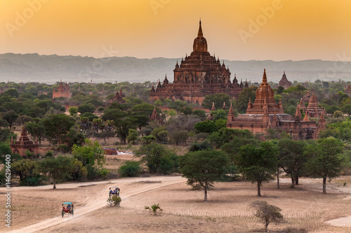 famous travel and landscape scene of ancient temples and carriages at sunset in Bagan, Myanmar. Top of the best destination of asia.