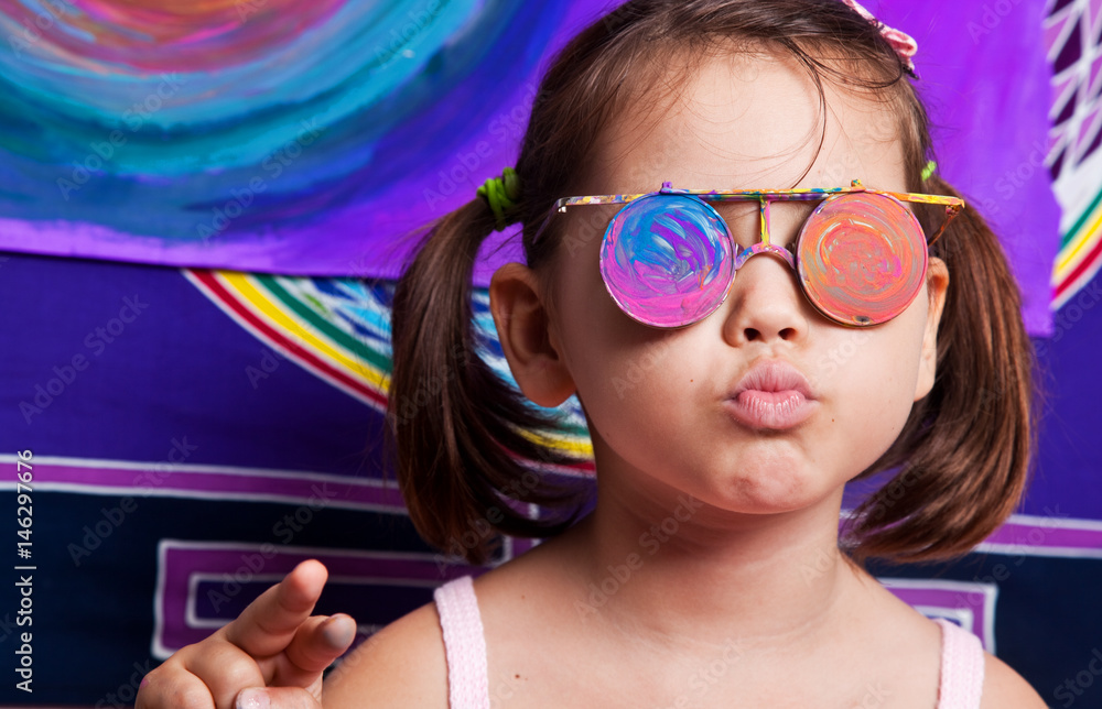 Little girl with painted glasses 