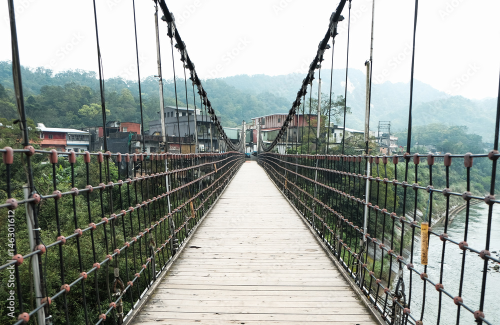 Hanging bridge over river
