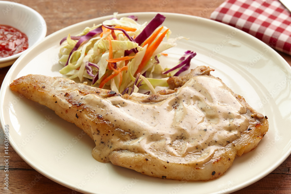 Pork chops steak hot grilled with salad closeup shot, lunch  or dinner favorite dish.