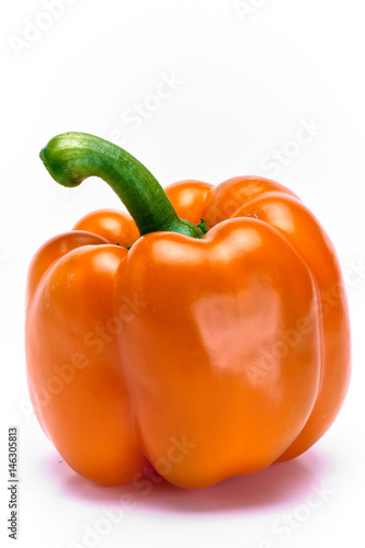 Fototapeta Naklejka Na Ścianę i Meble -  Close up of organic orange bell pepper on white