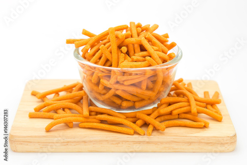 Hard bread creaker on glass bowl, on white background photo