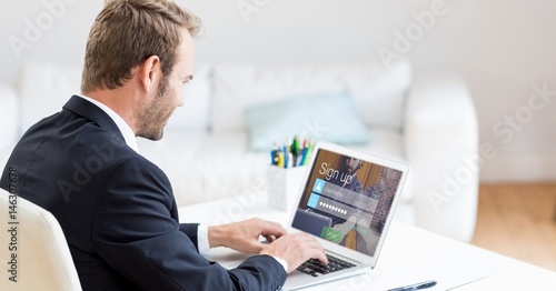 Businessman signing up on web page using laptop