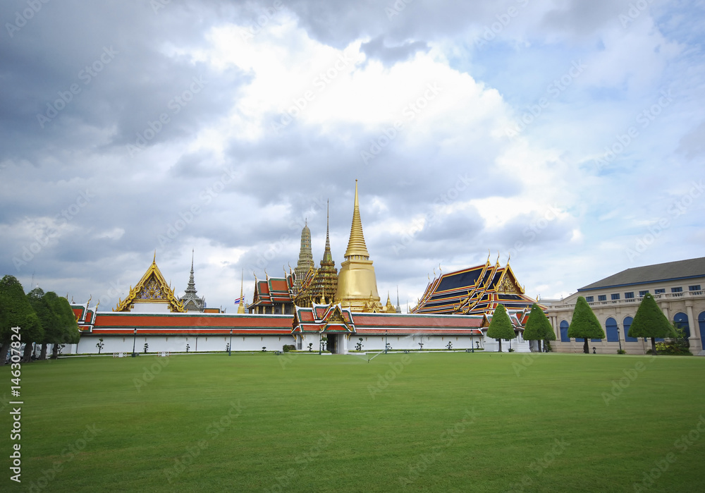 Wat phra kaew and The royal palace in Thailand with blue storm sky