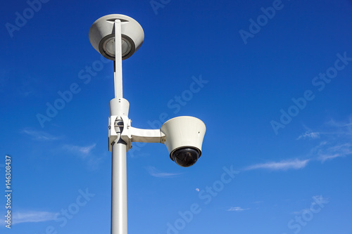 security cctv cameras on a pole with blue sky background