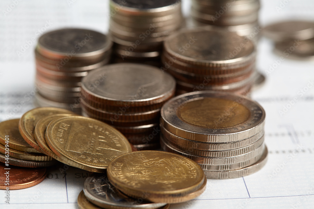 Coins stack with blue home toys on passbook. Saving, income and payment concept. Coins stack with blue home toys on passbook. Saving, income and payment concept.