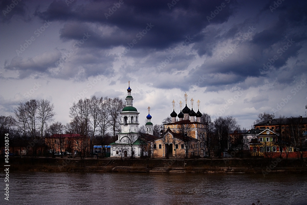 orthodox church river bank sky clouds