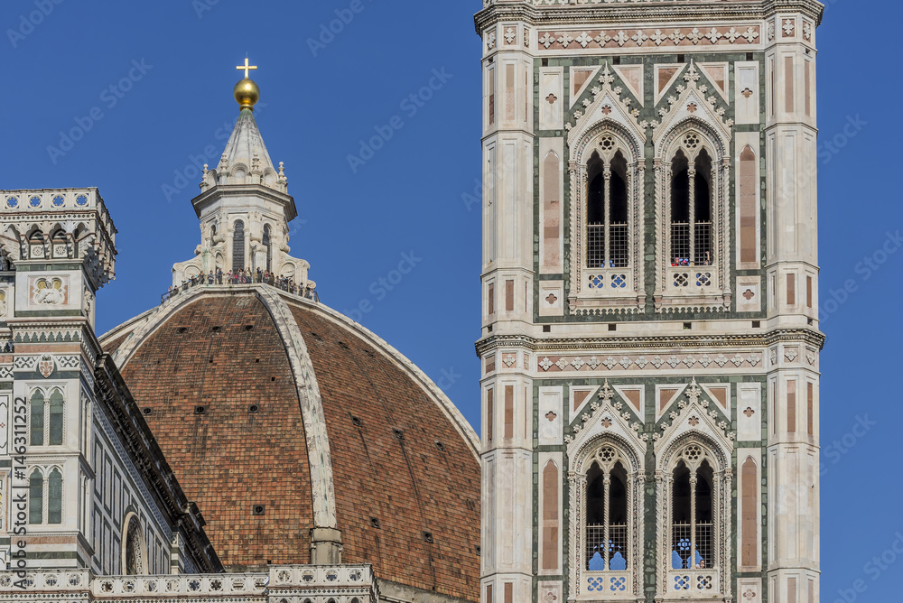 Beautiful detail of Giotto's Campanile and Cathedral Santa Maria del Fiore, Duomo of Florence, Italy, on a sunny day